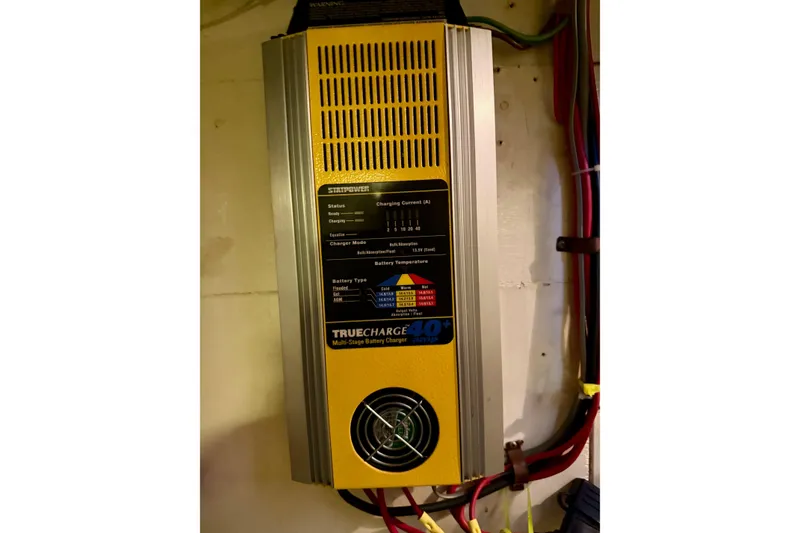 Slide: The Image of Battery charger in a 1991 Grand Banks 36 Europa boat, featuring TrueCharge 40+ model. - 54