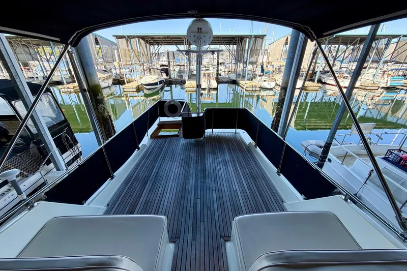Slide: The Image of Grand Banks 36 Europa 1991 yacht deck overlooking marina with moored boats. - 58