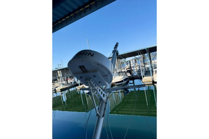 Slide: The Image of Radar equipment on a 1991 Grand Banks 36 Europa yacht docked at a marina. - 62