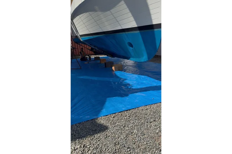 Slide: The Image of 1991 Grand Banks 36 Europa yacht on blue tarp during maintenance. - 64