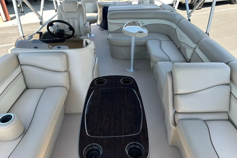 Slide: The Image of Luxurious interior of a 2015 Bennington 22 SSX pontoon boat with plush seating. - 9