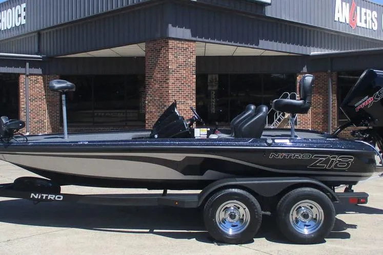 The Image of 2026 Nitro Z18 Pro fishing boat on trailer outside dealership. - 1