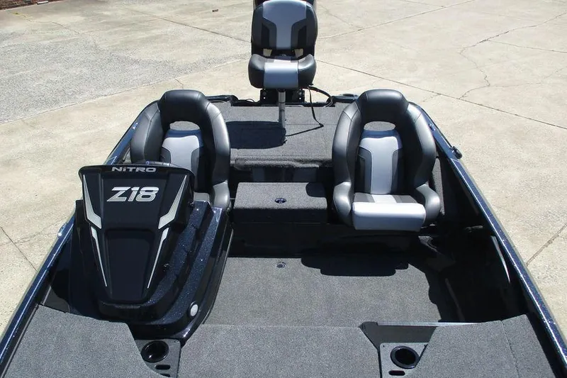 Slide: The Image of 2026 Nitro Z18 Pro boat interior with three sleek, modern seats on a gray deck. - 11