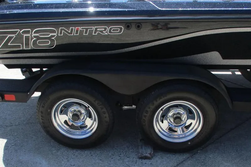 Slide: The Image of 2026 Nitro Z18 Pro boat trailer with dual wheels and sleek black design. - 4