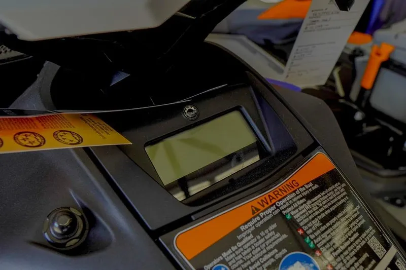 Slide: The Image of Close-up of 2026 Sea-Doo Spark for 3 dashboard with warning labels. - 7