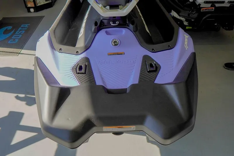 Slide: The Image of 2026 Sea-Doo Spark for 3, rear view in a showroom setting. - 9