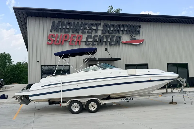 The Image of 2000 Chris Craft 262 Sport Deck boat on trailer at Midwest Boating Super Center. - 1