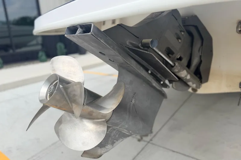 Slide: The Image of Close-up of a 2000 Chris Craft 262 Sport Deck boat propeller and outdrive. - 11