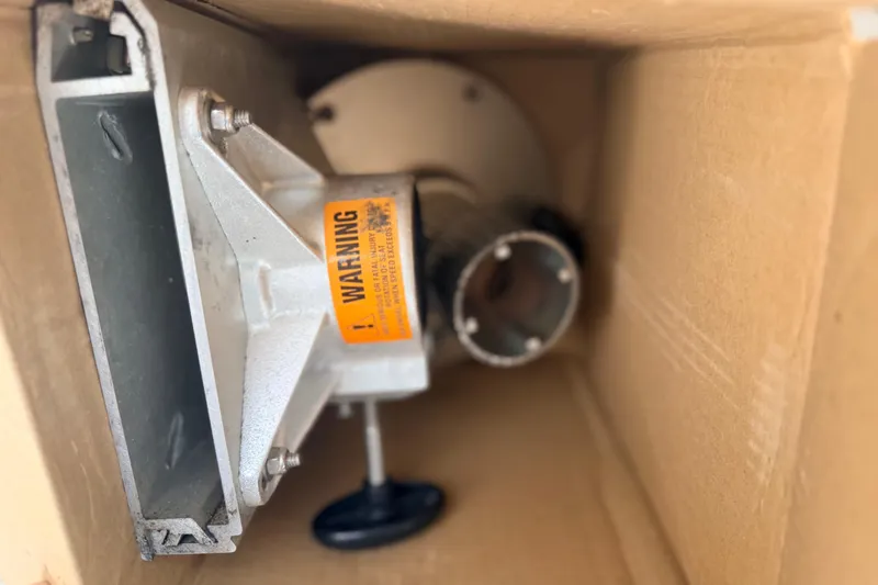 Slide: The Image of Cardboard box containing a metal boat part with warning label, for 2000 Chris Craft 262 Sport Deck. - 29