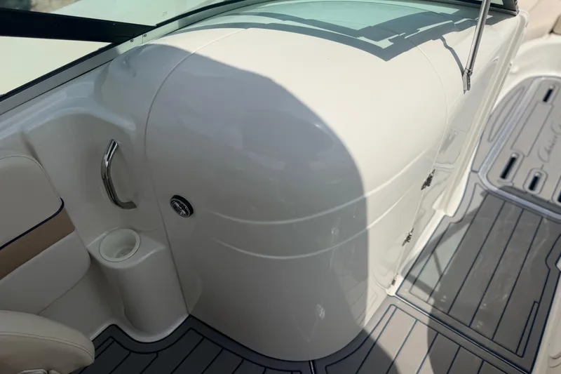 Slide: The Image of 2000 Chris Craft 262 Sport Deck interior with sleek white design and modern features. - 33