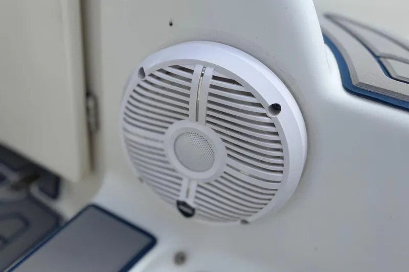 Slide: The Image of Close-up of a white speaker on a 2000 Chris Craft 262 Sport Deck boat. - 34
