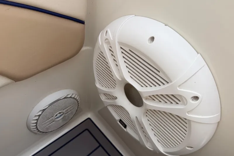 Slide: The Image of White speaker on a 2000 Chris Craft 262 Sport Deck boat interior. - 39