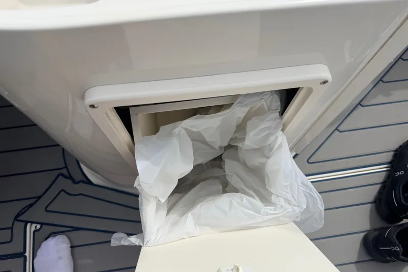 Slide: The Image of Trash compartment on a 2000 Chris Craft 262 Sport Deck boat. - 41