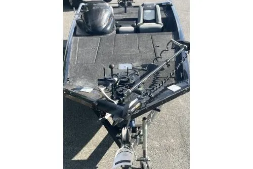 Slide: The Image of 2016 Lowe Stinger 180 boat with motor and seating, viewed from the front. - 2