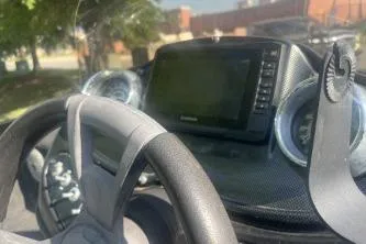 Slide: The Image of 2016 Lowe Stinger 180 dashboard with steering wheel and electronic display. - 6