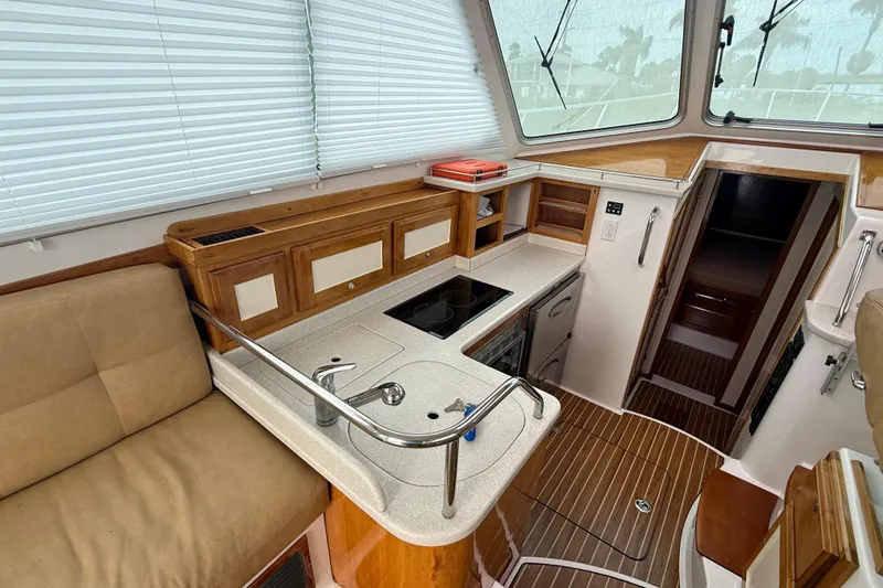 Slide: The Image of Striped seating area on a 2011 Back Cove Downeast 37 boat deck. - 19