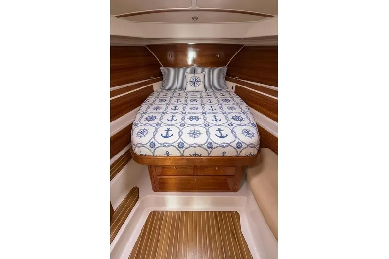 Slide: The Image of Back Cove Downeast 37 boat deck with striped seating, docked at marina, 2011 model. - 21