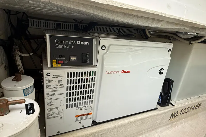 Slide: The Image of Cummins Onan generator in 2011 Back Cove Downeast 37 boat engine compartment. - 26