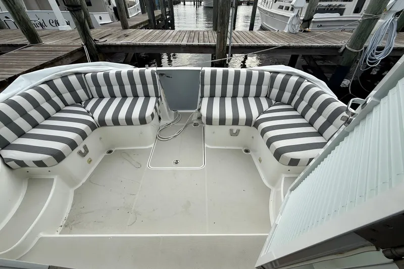Slide: The Image of Control panel of a 2011 Back Cove Downeast 37 boat, featuring navigation and communication equipment. - 8