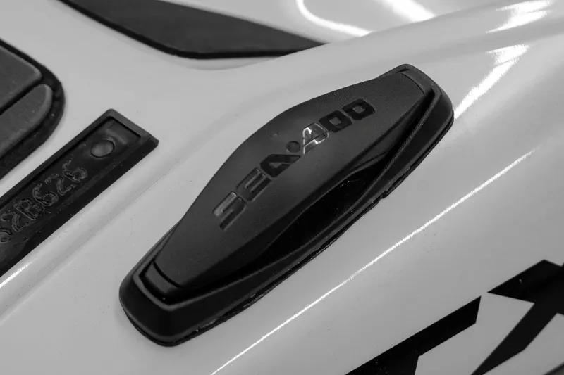 Slide: The Image of Close-up of 2026 Sea-Doo GTX Limited 325 logo on sleek white surface. - 15