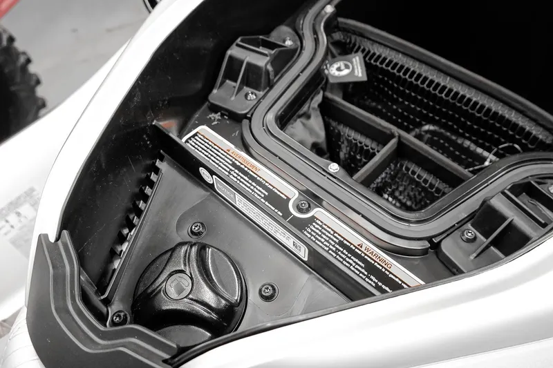Slide: The Image of 2026 Sea-Doo GTX Limited 325 engine compartment with detailed components and warning labels. - 23