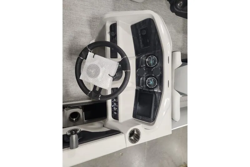 Slide: The Image of 2026 Tahoe Pontoon 1985 LTZ Cruise dashboard with steering wheel and instrument panel. - 12