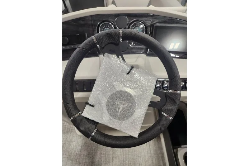 Slide: The Image of Steering wheel of 2026 Tahoe Pontoon 1985 LTZ Cruise, wrapped in protective bubble wrap. - 15