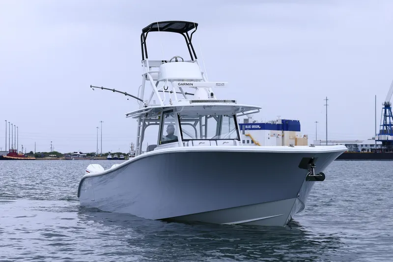 Slide: The Image of 2020 Yellowfin 42 Offshore boat on water, featuring sleek design and advanced navigation equipment. - 13