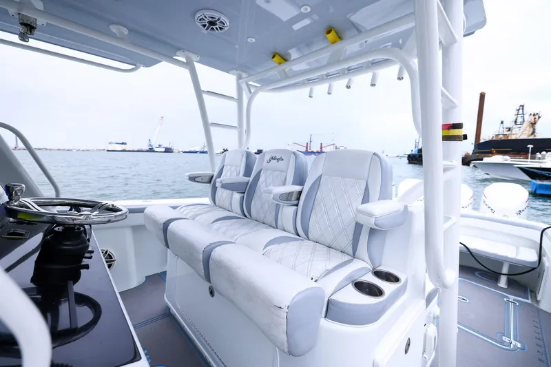 Slide: The Image of 2020 Yellowfin 42 Offshore boat interior with luxurious seating and ocean view. - 17
