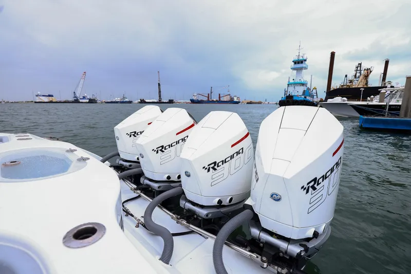 Slide: The Image of 2020 Yellowfin 42 Offshore boat with powerful outboard engines in a busy harbor. - 20