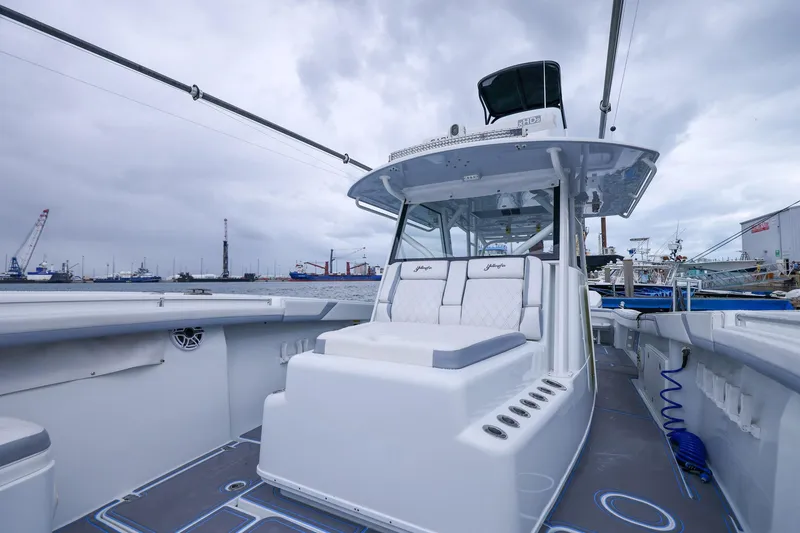 Slide: The Image of 2020 Yellowfin 42 Offshore boat with spacious deck and modern design in a marina setting. - 27
