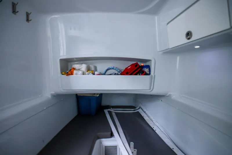 Slide: The Image of Interior storage of 2020 Yellowfin 42 Offshore boat, featuring organized compartments and equipment. - 37