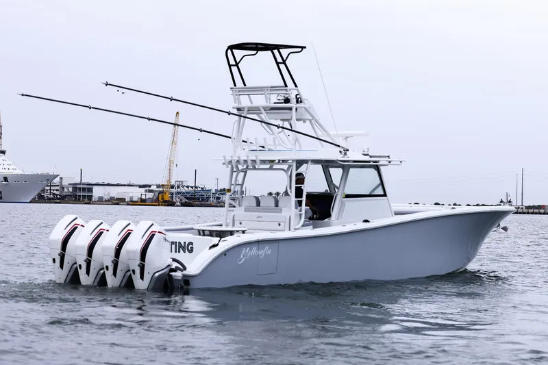 Slide: The Image of 2020 Yellowfin 42 Offshore boat with four engines, docked in a harbor. - 7