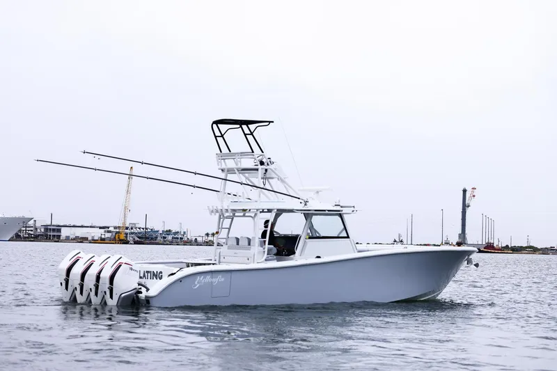 Slide: The Image of 2020 Yellowfin 42 Offshore boat with multiple outboard engines on the water. - 8