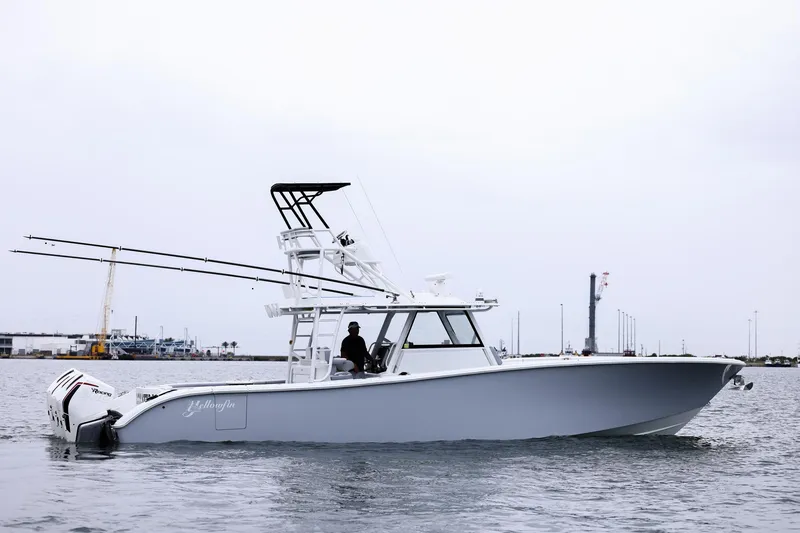 Slide: The Image of 2020 Yellowfin 42 Offshore boat on calm water, side view. - 9