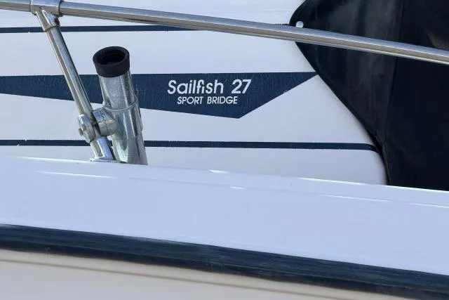Slide: The Image of 1996 Grady-White Sailfish 272 boat, featuring "Sailfish 27 Sport Bridge" branding. - 12