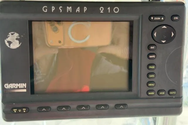 Slide: The Image of Garmin GPSMAP 210 device on a 1996 Grady-White Sailfish 272 boat dashboard. - 16