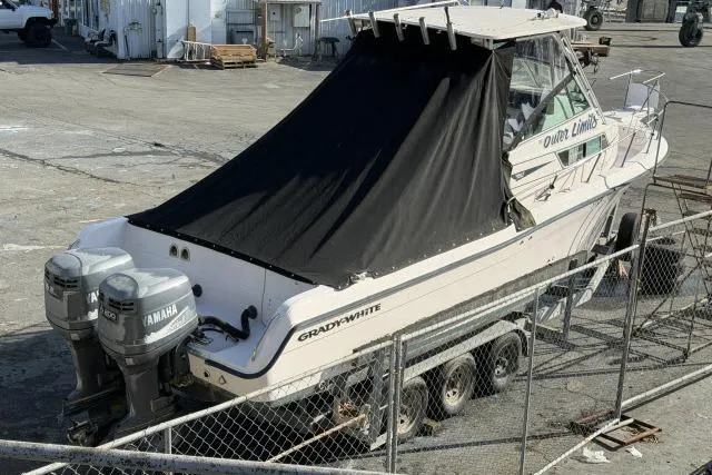 Slide: The Image of 1996 Grady-White Sailfish 272 boat with Yamaha engines, covered and on a trailer. - 8