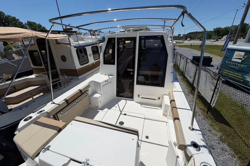 Slide: The Image of 2018 Ranger Tugs R-27 boat deck with seating and canopy frame. - 3