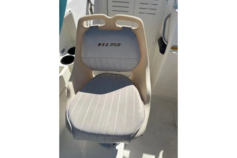 Slide: The Image of Captain's chair on 2001 Seapro 235 WAC boat, featuring "SEA PRO" branding. - 11