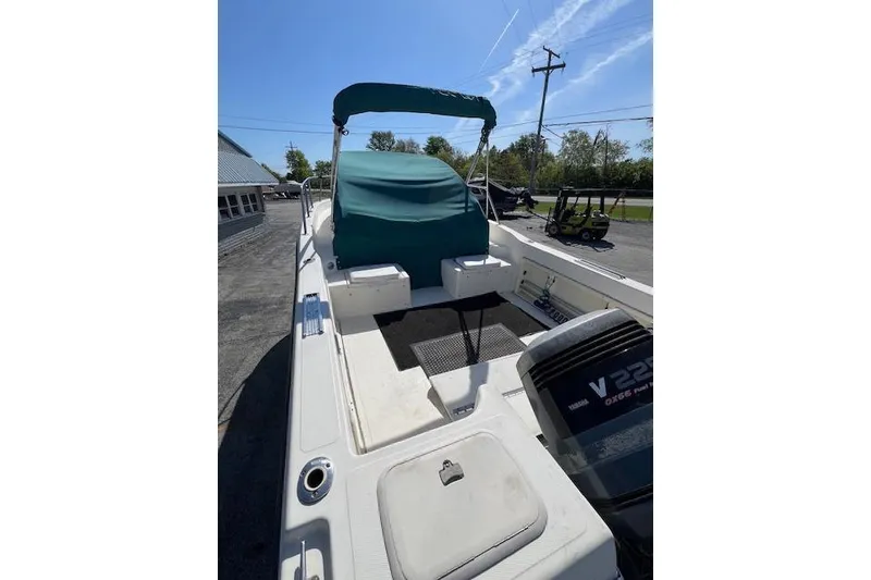 Slide: The Image of 2001 Seapro 235 WAC boat with green canopy and Yamaha V225 outboard motor. - 13