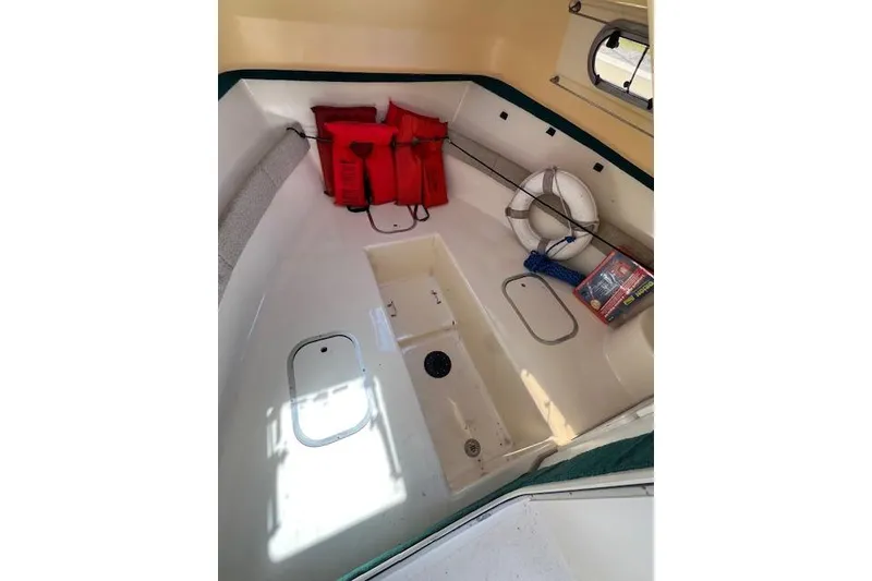 Slide: The Image of 2001 Seapro 235 WAC cabin interior with life jackets and safety equipment. - 3