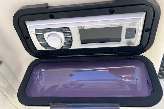 Slide: The Image of Pyle marine stereo system on a 2001 Seapro 235 WAC boat dashboard. - 7