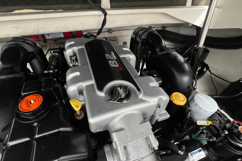 Slide: The Image of Engine of 2011 Sea Ray 300 Sundeck boat, featuring 8.2 MAG branding. - 3