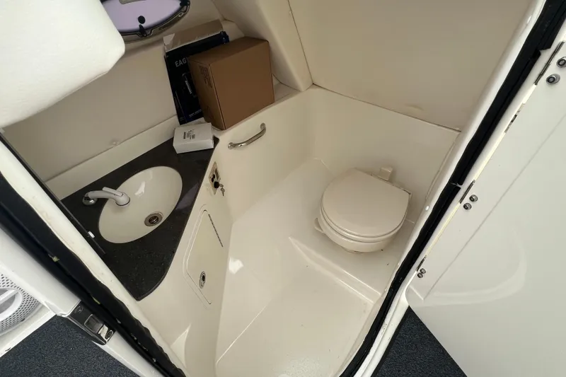 Slide: The Image of Interior of 2011 Sea Ray 300 Sundeck boat bathroom with sink and toilet. - 6