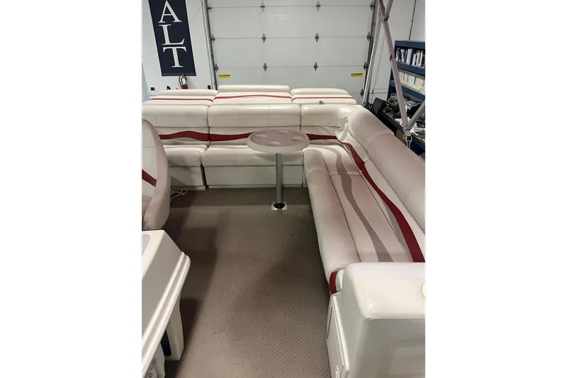 Slide: The Image of Interior of a 2002 Harris FloteBote 220 Super Sunliner with white and red seating. - 5