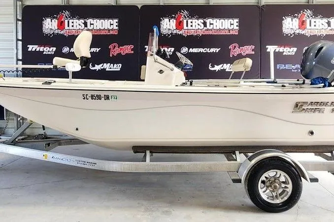 The Image of 2021 Carolina Skiff 19 LS boat on trailer, displayed at Anglers Choice event. - 1