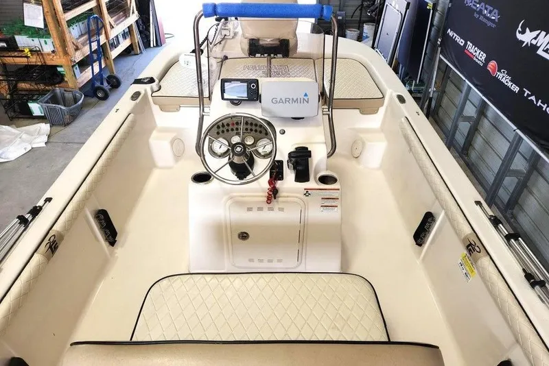 Slide: The Image of 2021 Carolina Skiff 19 LS boat interior with Garmin navigation system and steering console. - 3