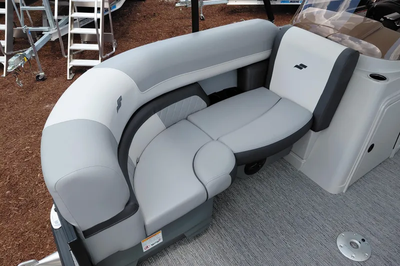 Slide: The Image of Luxurious seating on 2026 Starcraft EXS 1 Q DH boat, featuring sleek gray upholstery. - 13