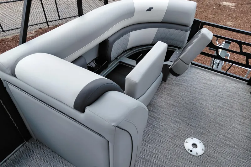 Slide: The Image of 2026 Starcraft EXS 1 Q DH boat interior with gray seating and storage compartments. - 18